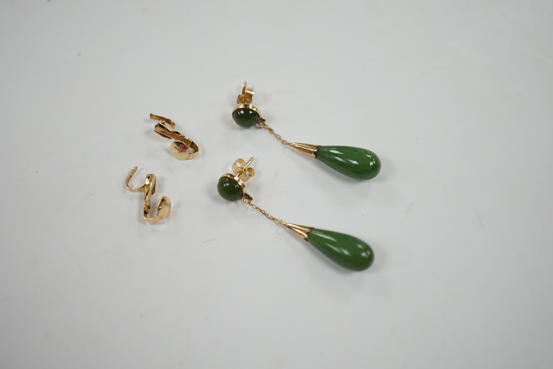 A pair of 375 and two stone jade set drop earrings, 44mm, with a pair of 14k fittings.